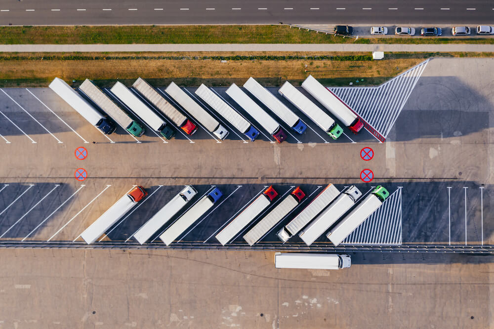 trucksparkedbesidehighway | Limepack Pahvimukien maailma | Limepack trucks parked beside highway